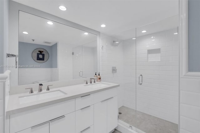 bathroom featuring vanity and a shower with shower door