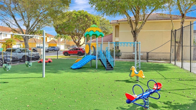 view of play area featuring a lawn