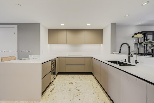 kitchen with kitchen peninsula, stovetop, beverage cooler, and sink