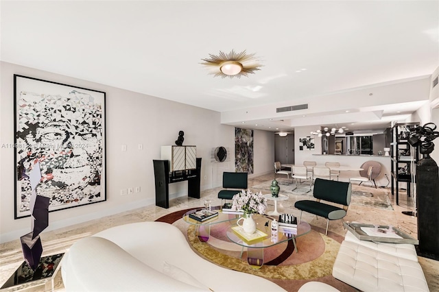 living room featuring an inviting chandelier