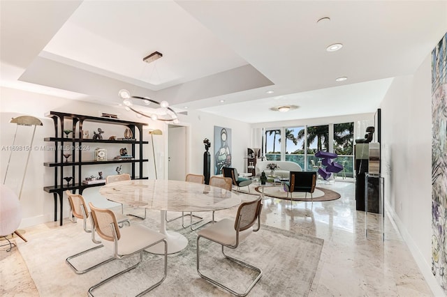 dining room with a tray ceiling