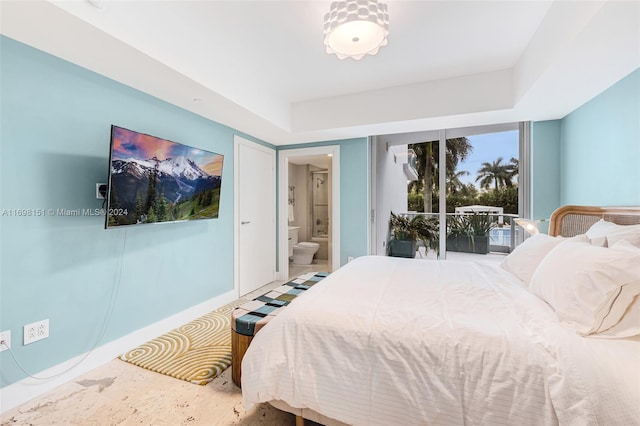 bedroom featuring access to outside and ensuite bathroom