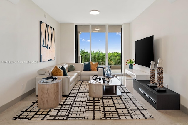 living room featuring floor to ceiling windows