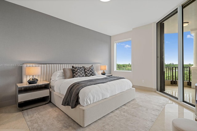 bedroom featuring access to exterior and light tile patterned flooring