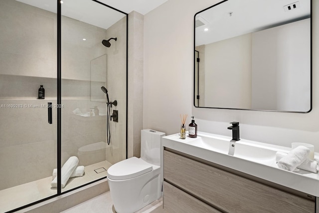 bathroom with vanity, an enclosed shower, and toilet