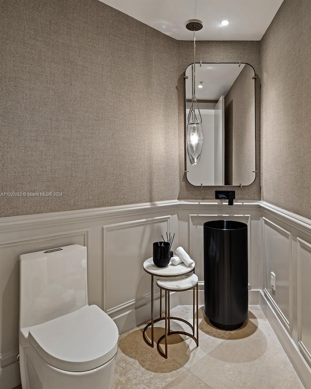 bathroom with tile patterned floors and toilet