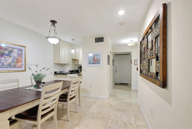 dining area with light tile patterned flooring