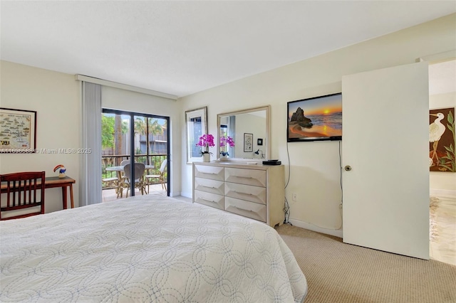 carpeted bedroom featuring access to exterior