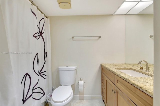 bathroom featuring toilet, a shower with curtain, and vanity