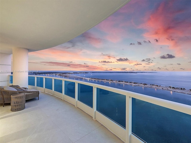 balcony at dusk with a water view