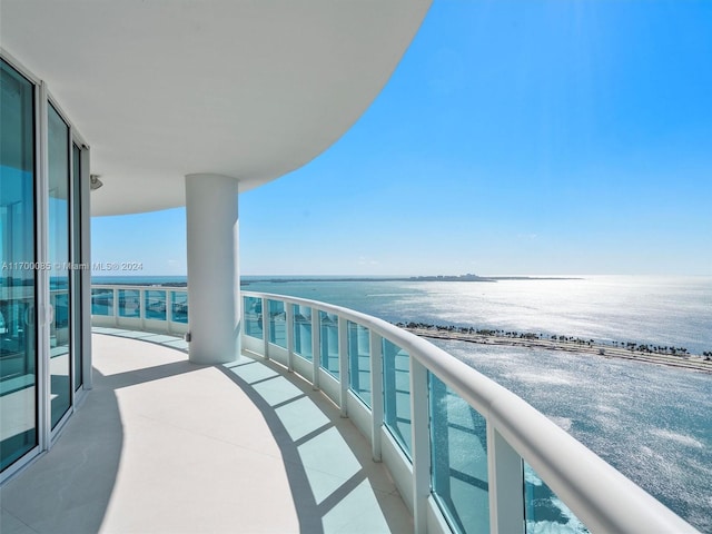 balcony featuring a water view