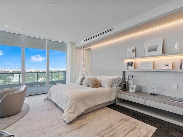 bedroom featuring a wall of windows