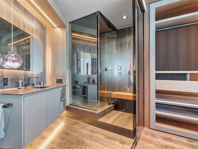 bathroom featuring vanity and hardwood / wood-style flooring