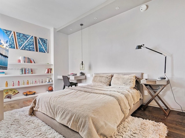 bedroom with wood finished floors