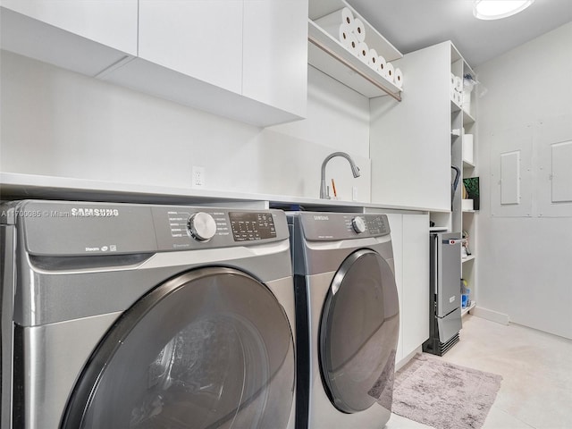 clothes washing area featuring washer and clothes dryer and sink