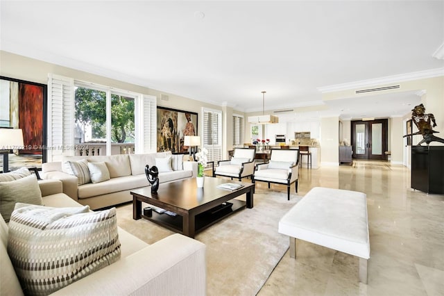 living room featuring crown molding