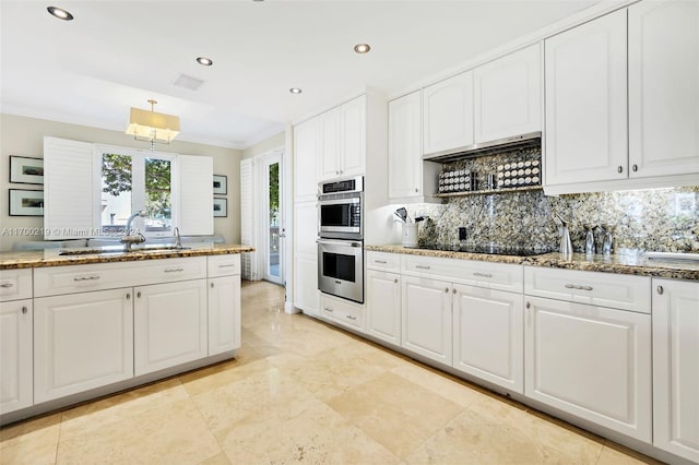 kitchen with crown molding, sink, tasteful backsplash, white cabinetry, and stainless steel double oven