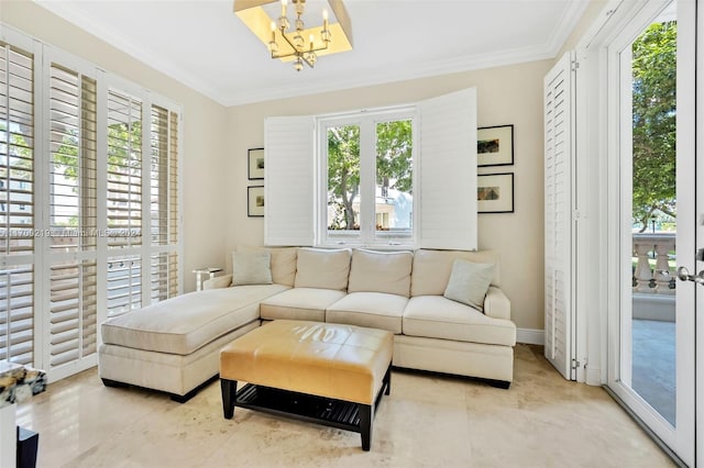 living room with a chandelier and ornamental molding