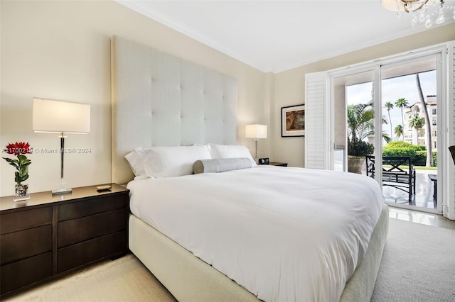 bedroom with crown molding, access to outside, and light hardwood / wood-style flooring