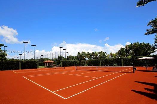 view of sport court featuring basketball hoop