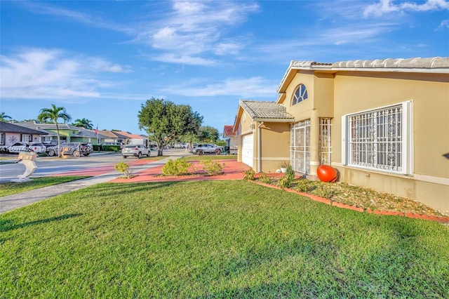 view of yard with a garage