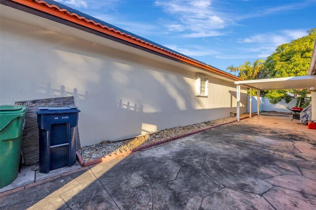 view of side of home featuring a patio area