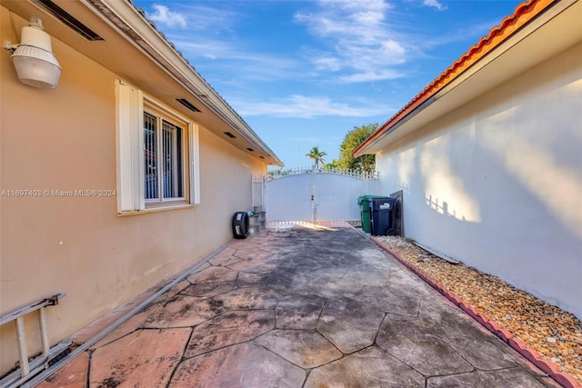 view of side of home with a patio area