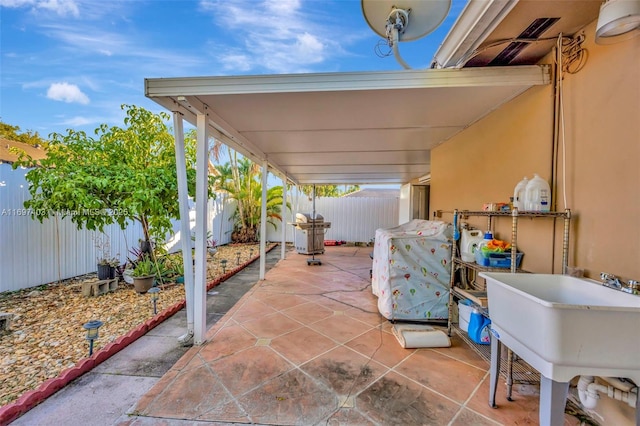 699 NW 134th Pl, Miami, FL 33182 - view of patio / terrace with a fenced backyard and a sink
