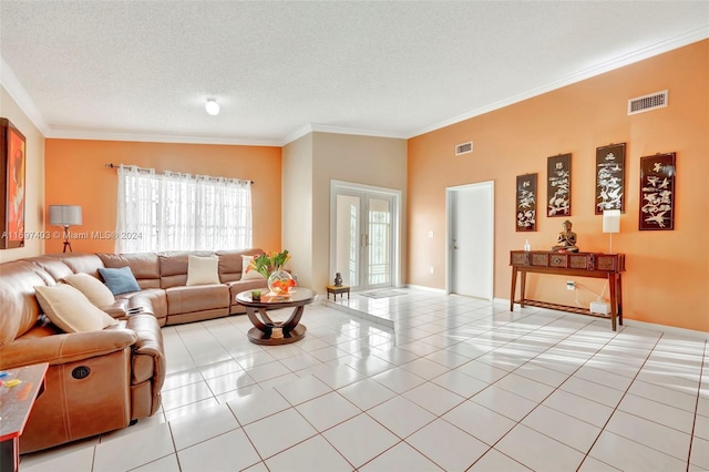 tiled living room featuring french doors, a textured ceiling, lofted ceiling, and crown molding