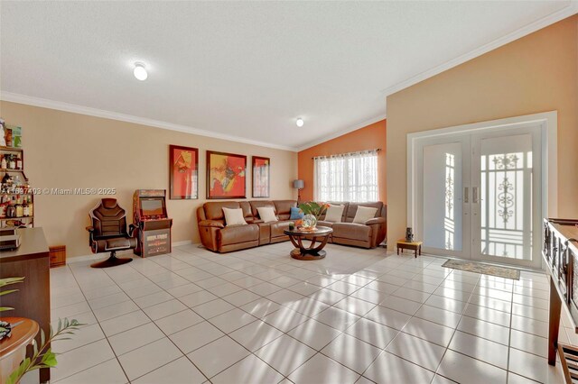 living room featuring a textured ceiling, light tile patterned floors, crown molding, and vaulted ceiling