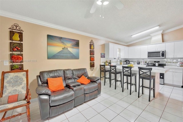 699 NW 134th Pl, Miami, FL 33182 - living area with crown molding, light tile patterned floors, lofted ceiling, ceiling fan, and a textured ceiling
