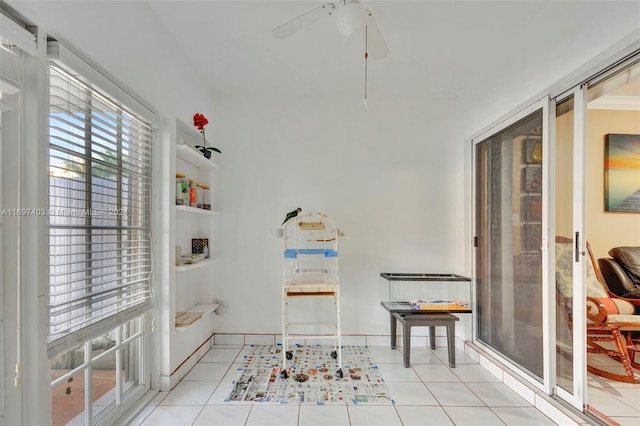 interior space featuring ceiling fan