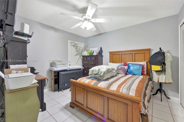 699 NW 134th Pl, Miami, FL 33182 - bedroom with a textured ceiling, light tile patterned floors, and a ceiling fan