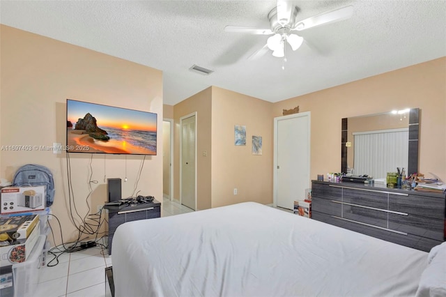 699 NW 134th Pl, Miami, FL 33182 - bedroom featuring ceiling fan, visible vents, a textured ceiling, and light tile patterned flooring