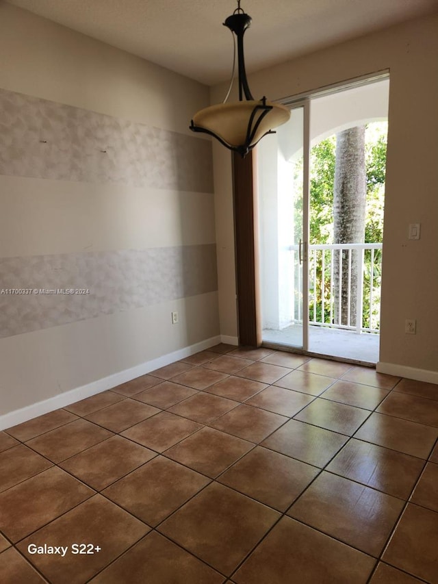 unfurnished dining area with tile patterned flooring