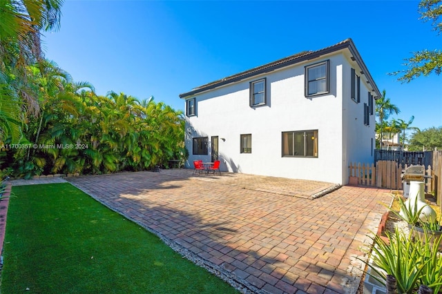 back of house featuring a patio area