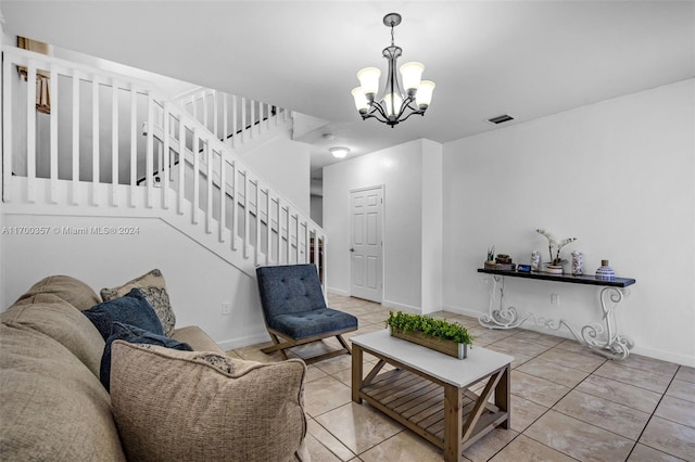 living room featuring light tile patterned flooring and a chandelier