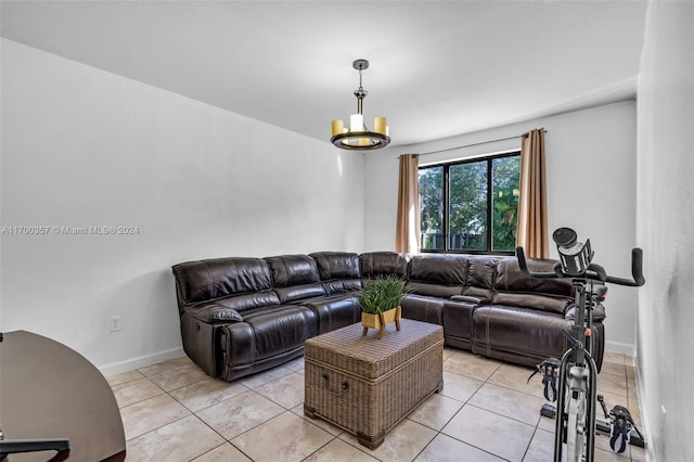 living room featuring a chandelier and light tile patterned floors