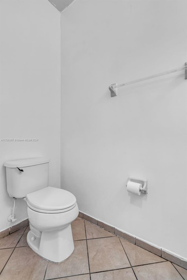 bathroom with tile patterned floors and toilet