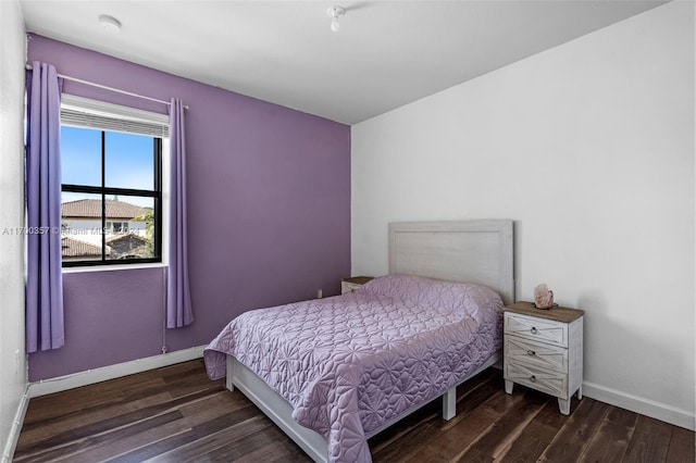 bedroom featuring dark wood-type flooring