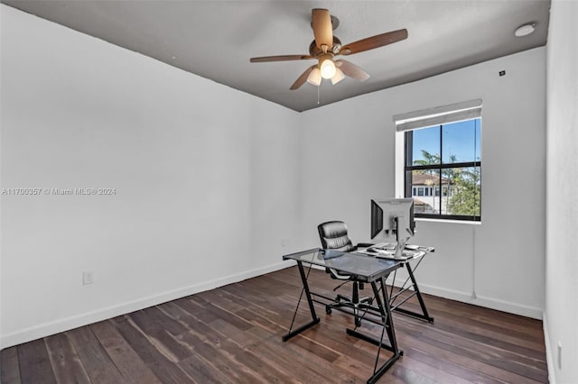 office area with ceiling fan and dark wood-type flooring