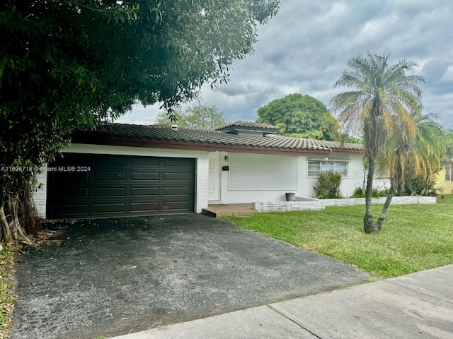 view of home's exterior featuring a yard and a garage