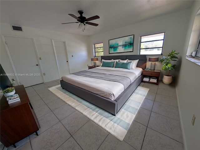 bedroom featuring ceiling fan and light tile patterned floors