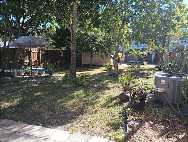 view of yard with central air condition unit