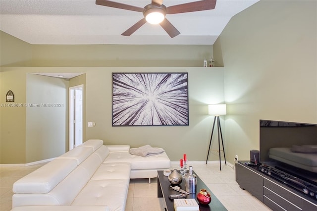 tiled living room featuring ceiling fan and lofted ceiling