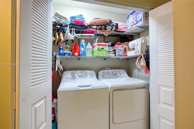 clothes washing area with washer and dryer