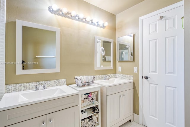 bathroom with tile patterned flooring and vanity