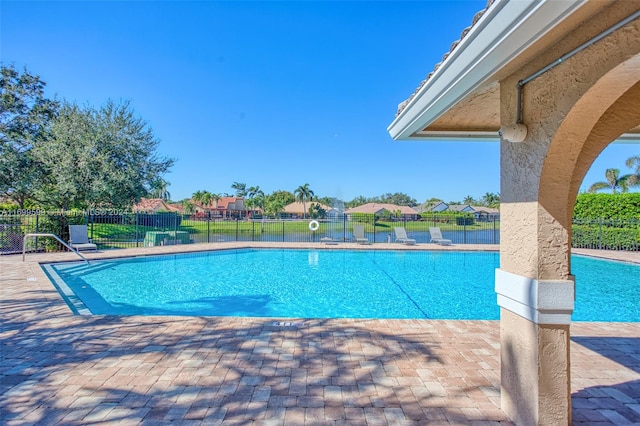 view of swimming pool with a patio area