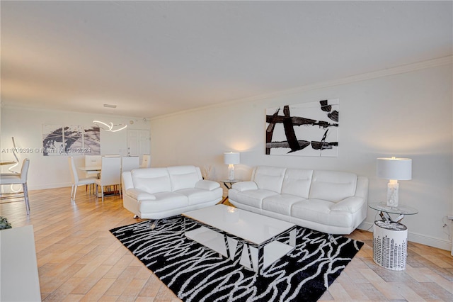 living room featuring wood-type flooring and ornamental molding