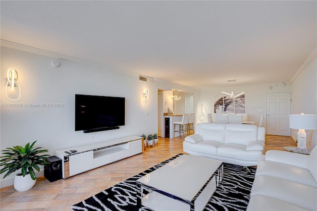 living room featuring light hardwood / wood-style floors and ornamental molding